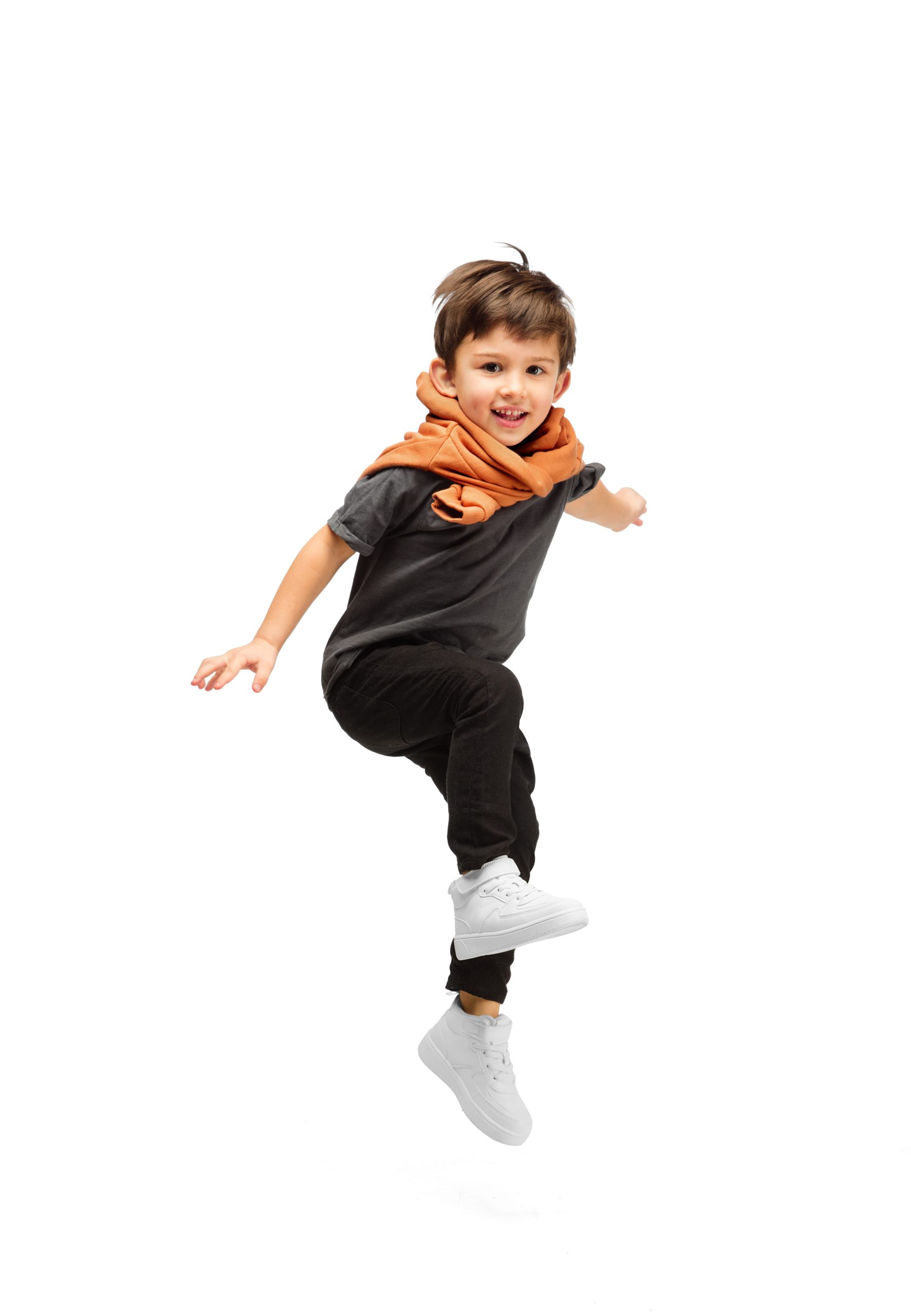 Jumping, running. Happy, smiley little caucasian boy isolated on white studio background with copyspace for ad. Looks happy, cheerful. Childhood, education, human emotions, facial expression concept.
